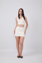 FALDA SHORT CON HEBILLAS Y CIERRE POSTERIOR PERLA - MERCY
